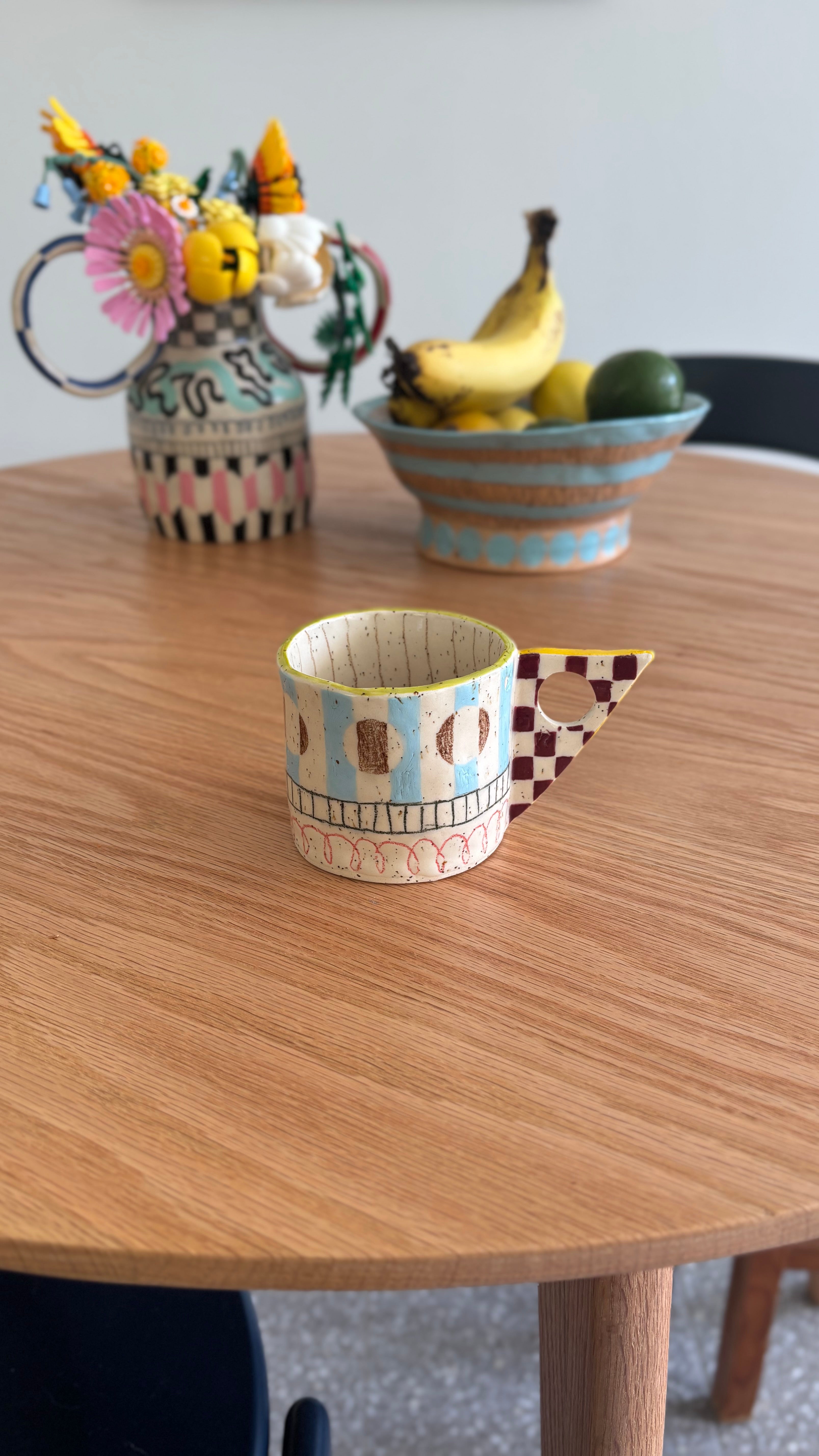 Hand-built and hand-painted ceramic mug 