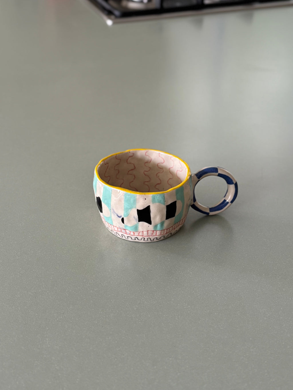 Small decorative mug on a kitchen countertop